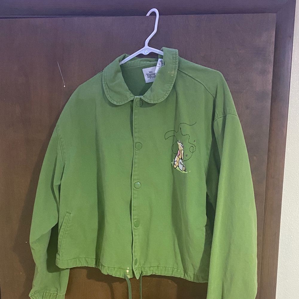 Disney Green Winnie the pooh jacket , has two stains